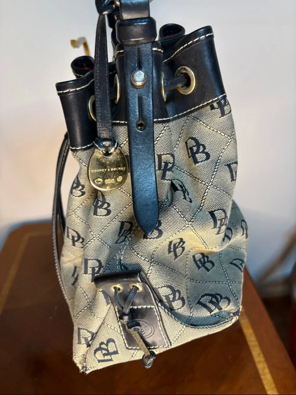 Dooney & Bourke Black Trim Signature Logo Drawstring Bucket Bag